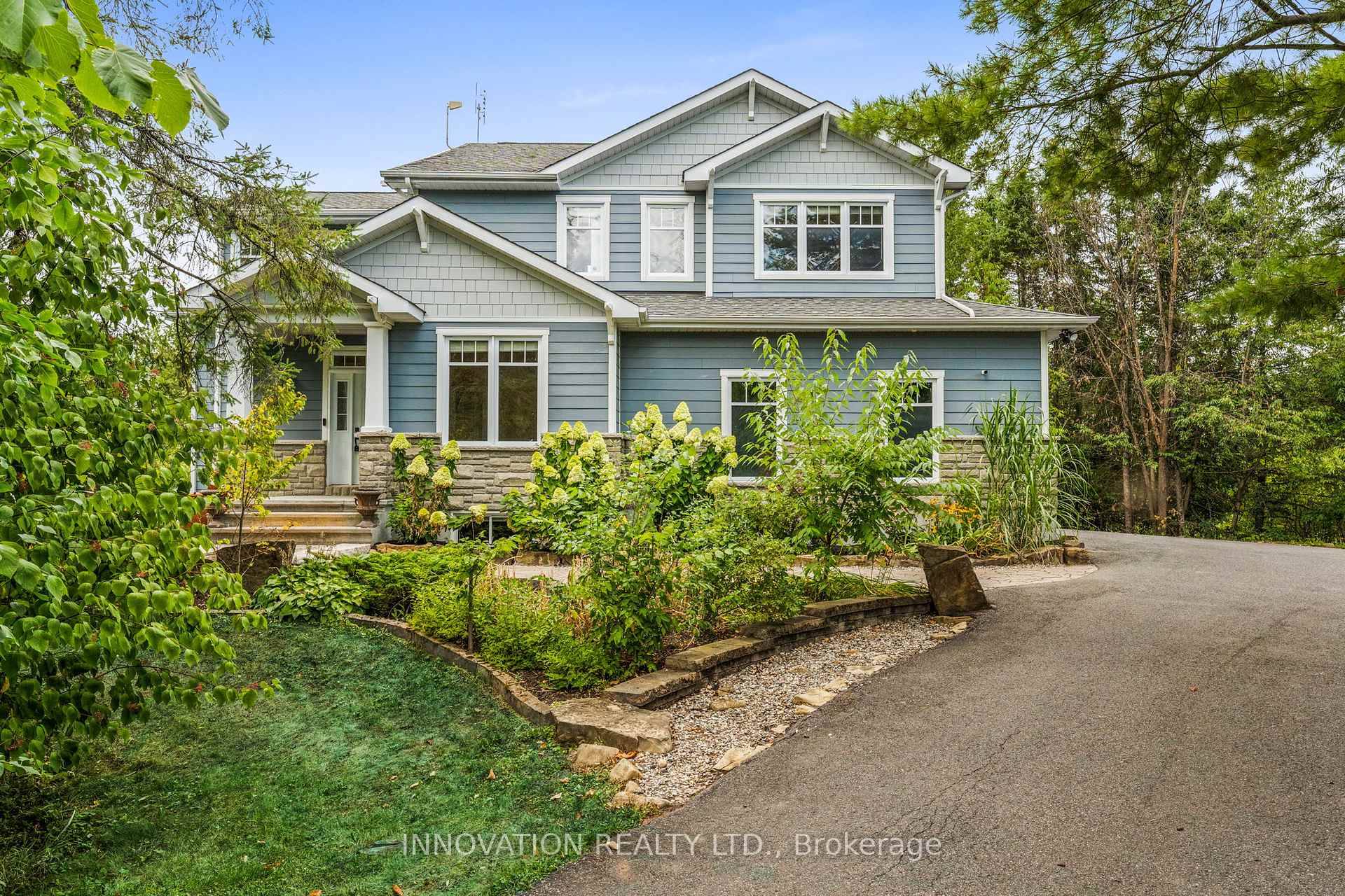 Welcome to 199 Blackberry Way, a dream residence where luxury, privacy, and nature harmonize on a beautifully landscaped 2 acre lot in the waterfront community of Dunrobin Shores.