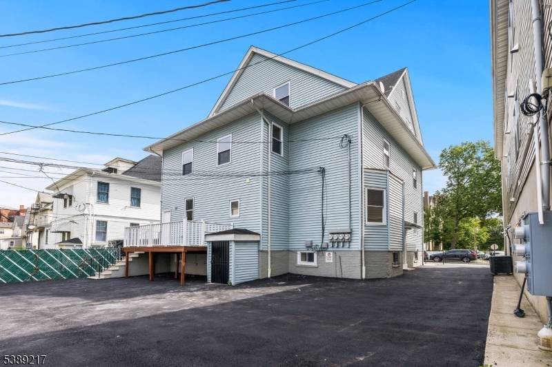 Welcome to this stunning three unit home nestled in one of East Orange's most vibrant and convenient neighborhoods.