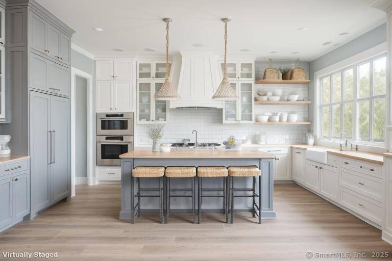 Nestled in the charming coastal town of Old Lyme, Connecticut, this expansive 3345 square foot farmhouse offers a perfect blend of rustic elegance and modern comfort.