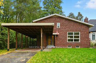 Welcome to this custom one of a kind home with vaulted living room with gas fireplace, awaiting a very large Christmas tree.