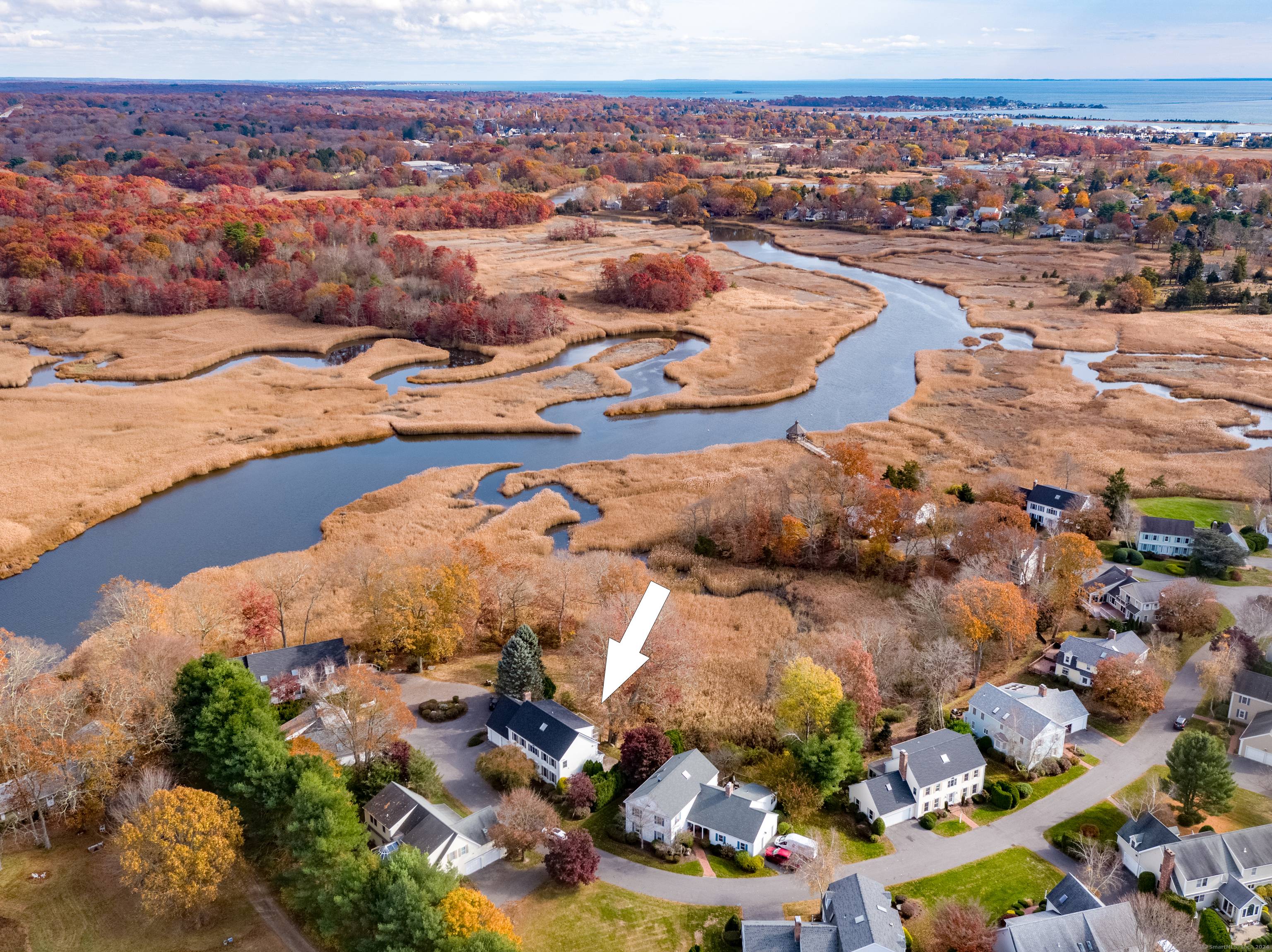 Privately sited at the end of Longview Terrace with expansive marsh and river views this larger than most free standing colonial at over 3700 sf offers luxurious condo living.