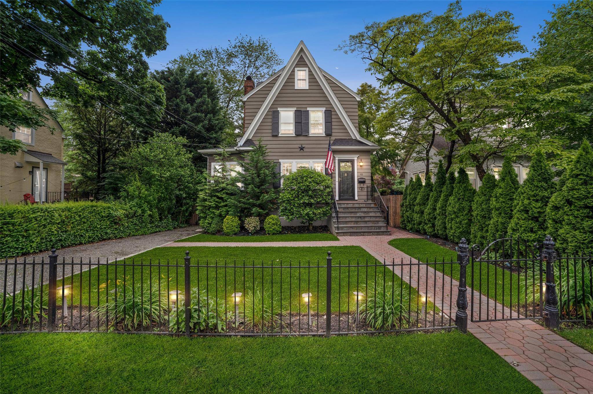 Welcome to this charming and light filled Colonial nestled in the heart of Bronxville.