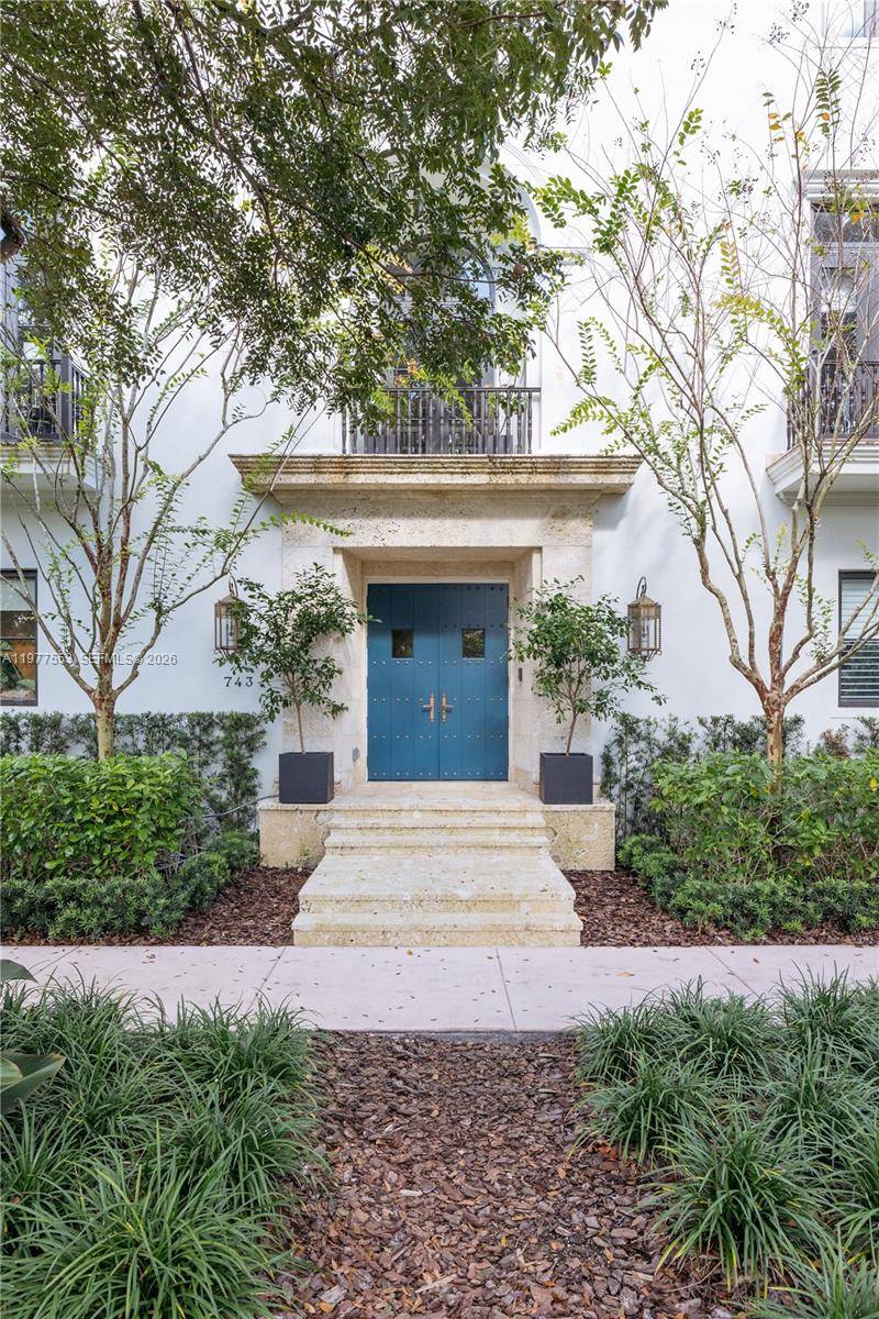 Located in Coral Gables on a picturesque tree lined street, this refined corner residence reflects Spanish Colonial brownstone architecture.