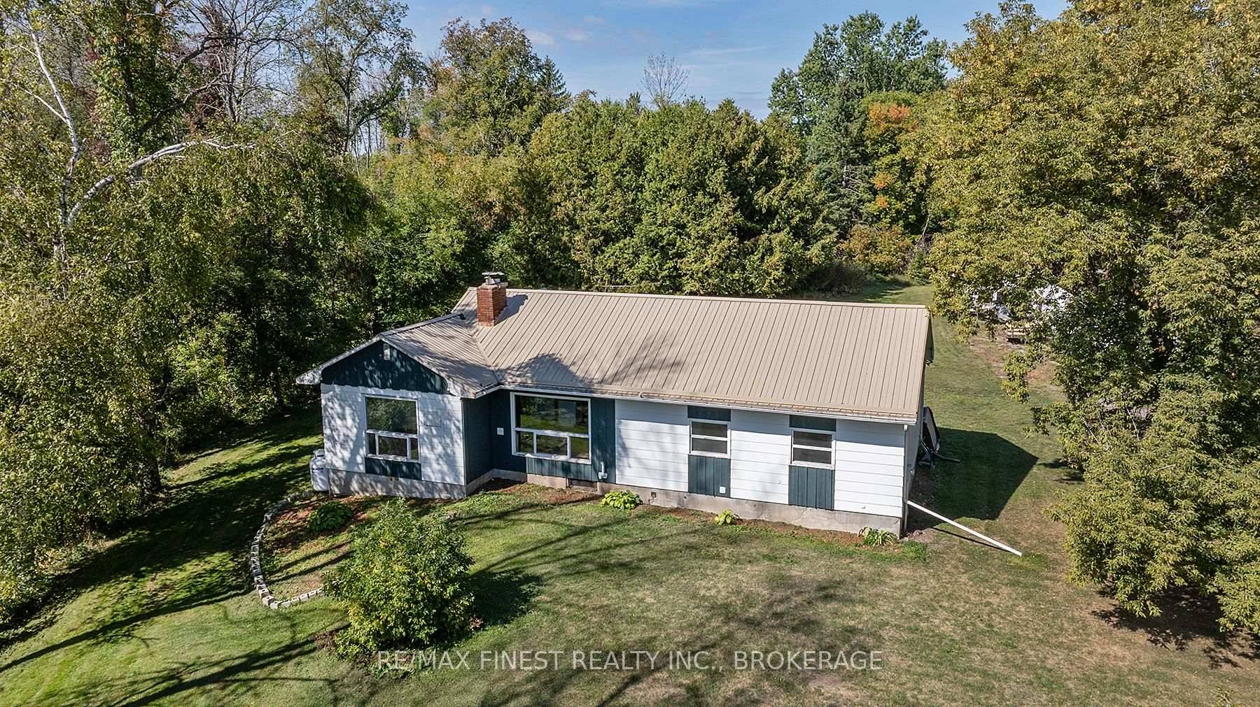 Set well back from the road for peace and privacy, this well designed bungalow sits on nearly 1.