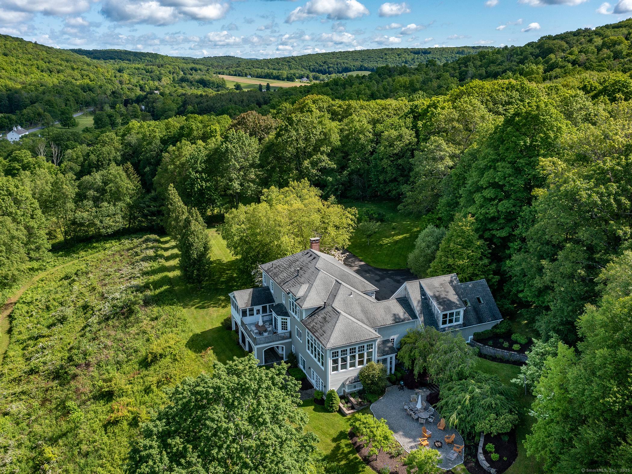 Simply stunning long western views of Lake Waramaug and the Litchfield Hills !