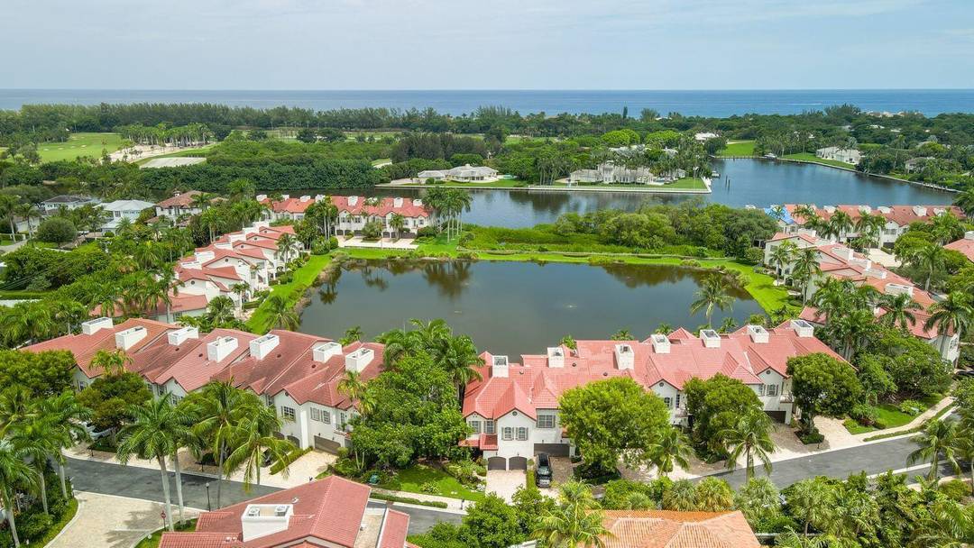 Nestled in the prestigious Estuary community, this 24 hour guard gated gem offers breathtaking lake and Intracoastal views, complete with private beach access and a kayak launch.