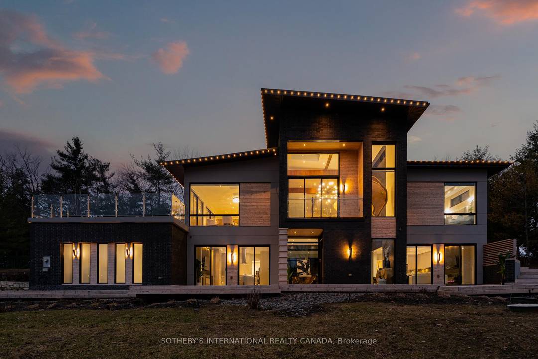 Set on an exceptional 1 acre estate lot surrounded by mature trees.