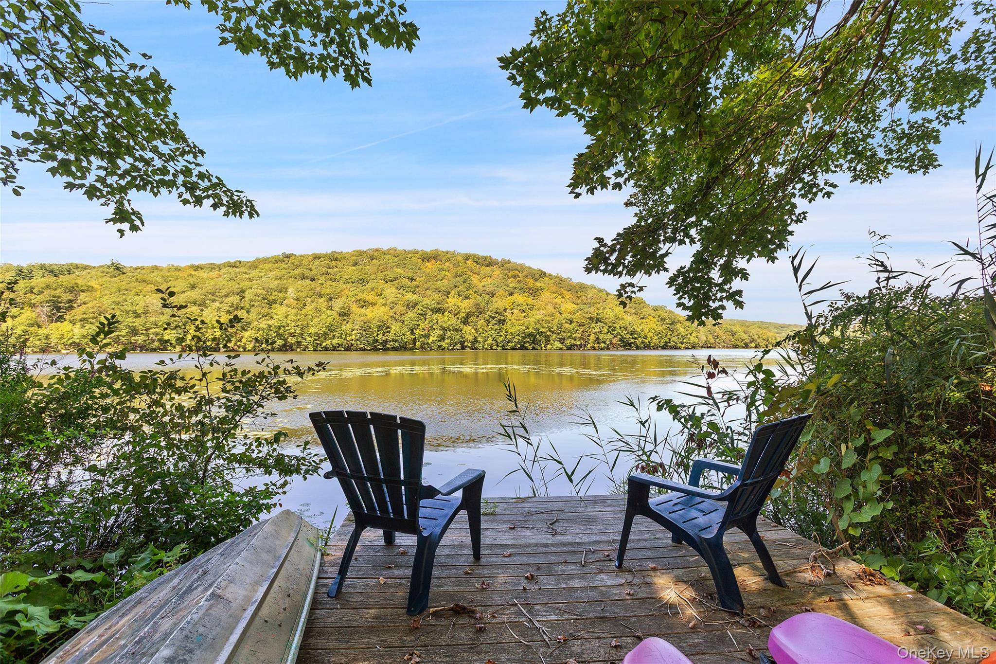 LAKEFRONT DOCK and a PERFECT PRIVATE HOME with incredible privacy amp ; outdoor fire pit that presents a magical setting bundled together in one sale !