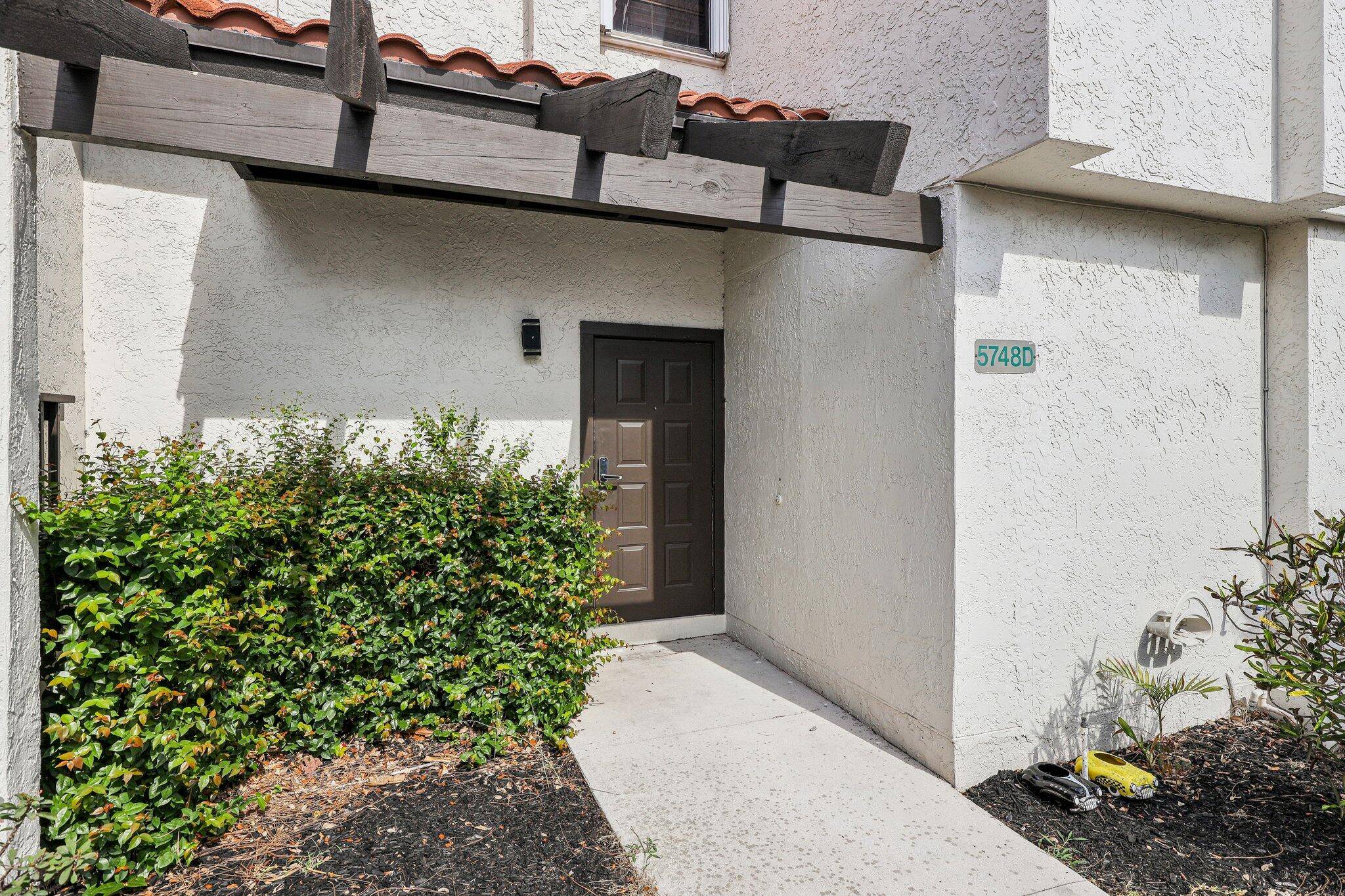 Welcome to this highly desirable corner townhome located in a secure, manned gate community, just moments from the Town Center and a short 10 minute drive to the beautiful beaches ...