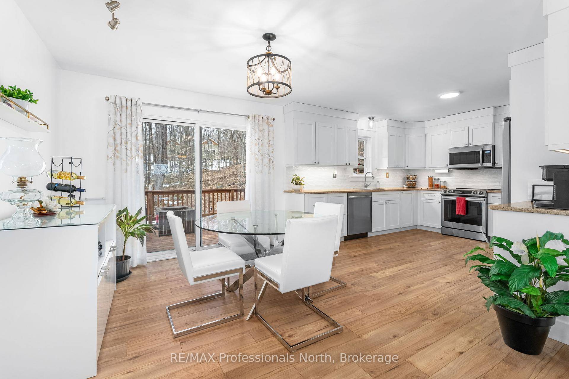 This inviting 3 bedroom 2 1 raised bungalow, built in 2018, sits on an elevated lot and offers incredible views of Mirror Lake.