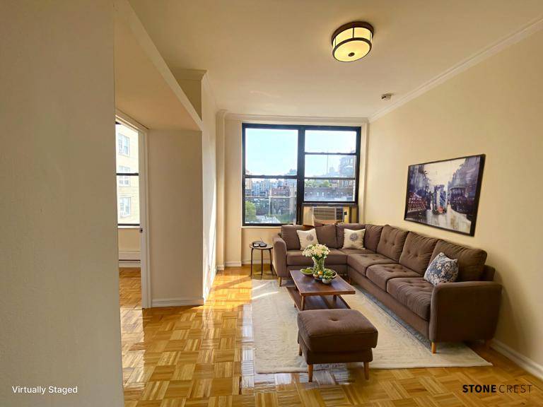 South facing and Sunny renovated two bedroom apartment with central air in well kept doorman building with a roof deck and laundry room.