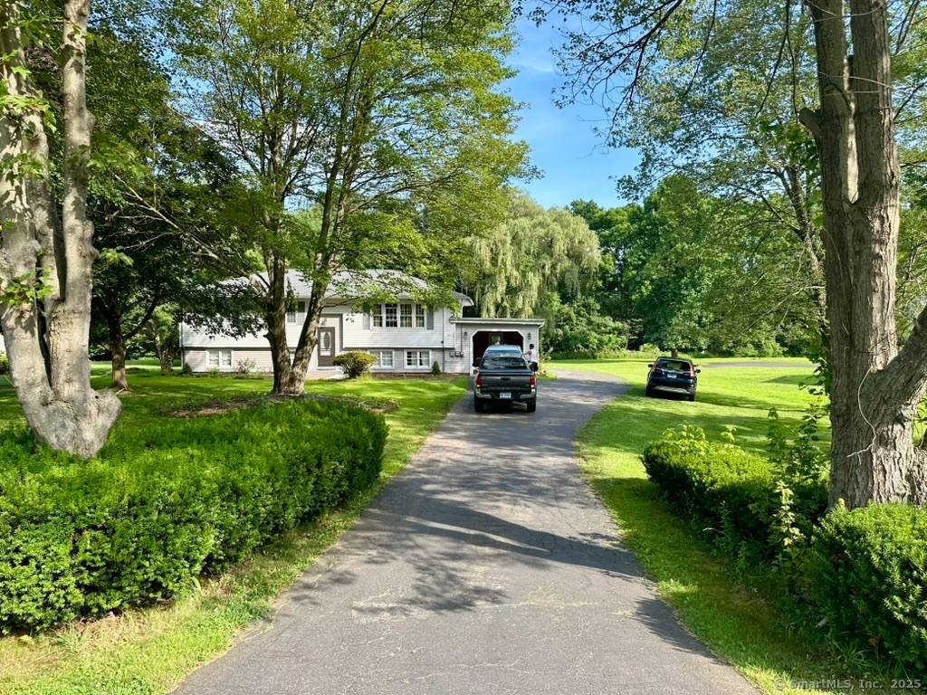 Come and experience comfortable living in a raised ranch style residence nestled on almost one acre of level, open land.