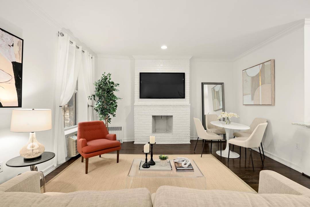 Step into this stunning two bedroom condominium, a perfect blend of modern luxury and urban charm, just a block away from Central Park.