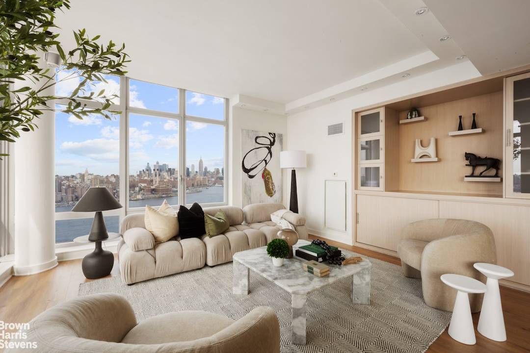 Apartment 27A is a corner 2 bedroom, 2 bath residence with walls of windows framing Western and Southern views spanning from Manhattan's midtown skyline to the iconic Brooklyn Bridge.