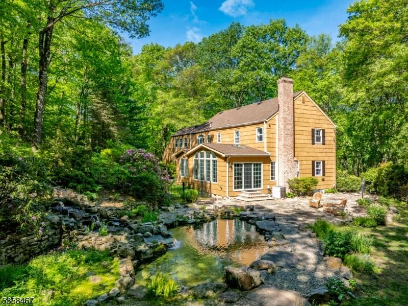 Set on over 3 secluded, tree lined acres, this private oasis blends natural beauty, tranquility, and convenience just minutes from downtown Morristown, the Midtown Direct train to NYC, and nearby ...
