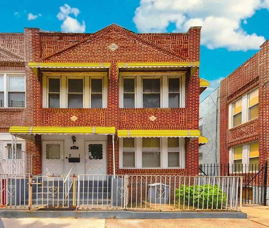 This red brick semi attached two family home was built in 1925.