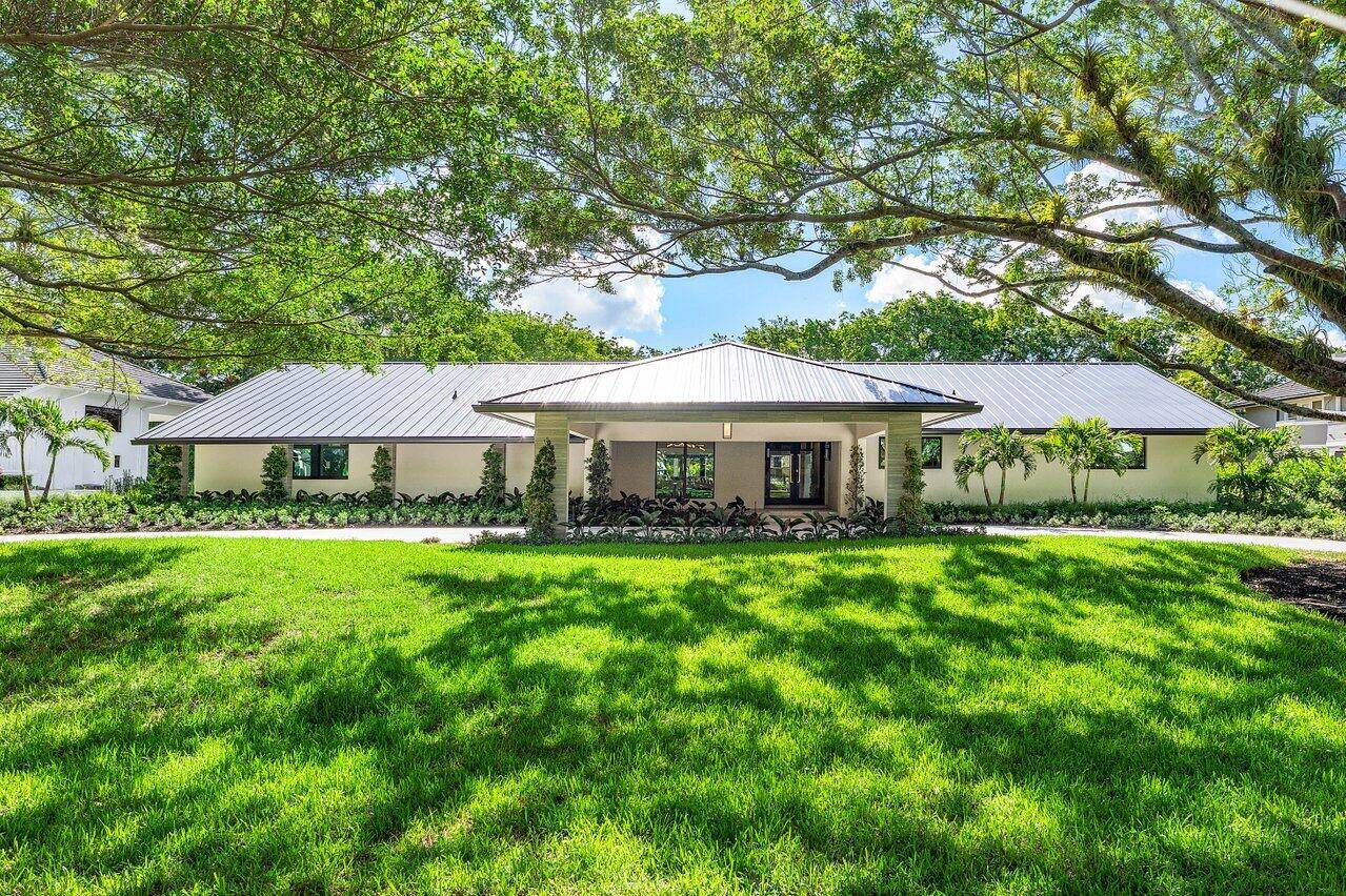Discover unparalleled luxury and contemporary elegance at 8090 Twin Lake Drive, a meticulously renovated single level estate nestled on a sprawling over one acre lot in the exclusive gated community ...