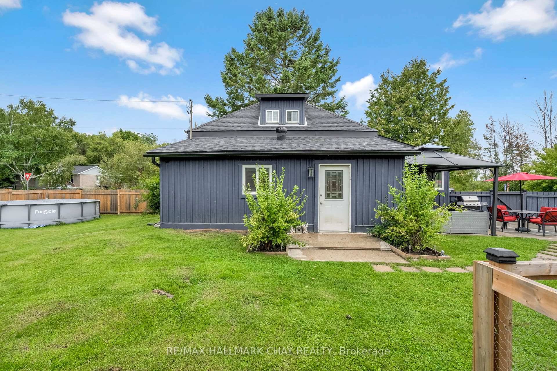 Tucked onto a peaceful corner lot, this charming 1.