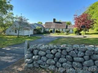 This quintessential L shaped Cape Cod Home sits on 2 acres tucked behind a 200ft long stonewall.