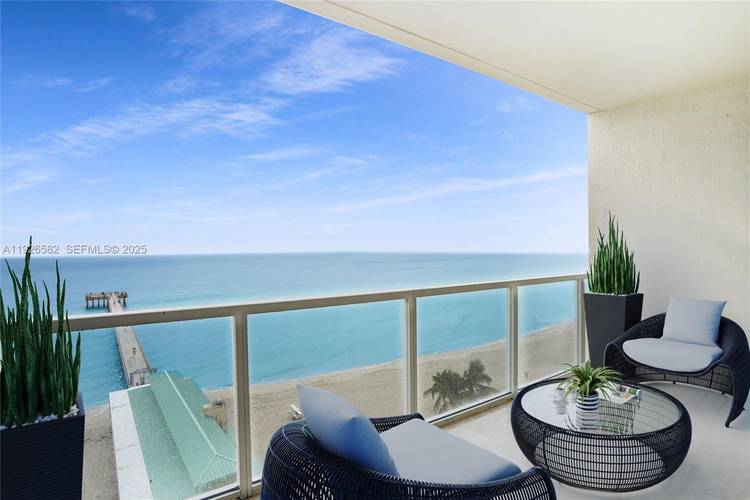Price adjusted and now offered at an Exceptional value for this his Oceanfront corner residence featuring 2 luxurious primary suites, 2.