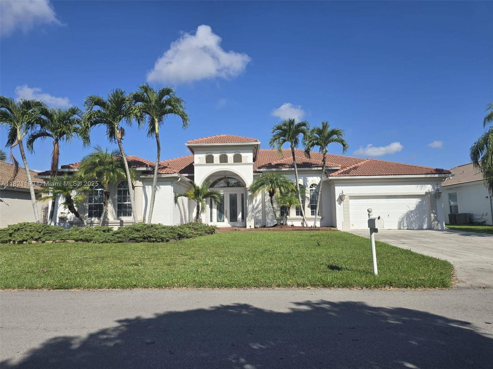 Stunning lakefront home in Fairways at Keys Gate, the largest in the community with unmatched space and luxury.