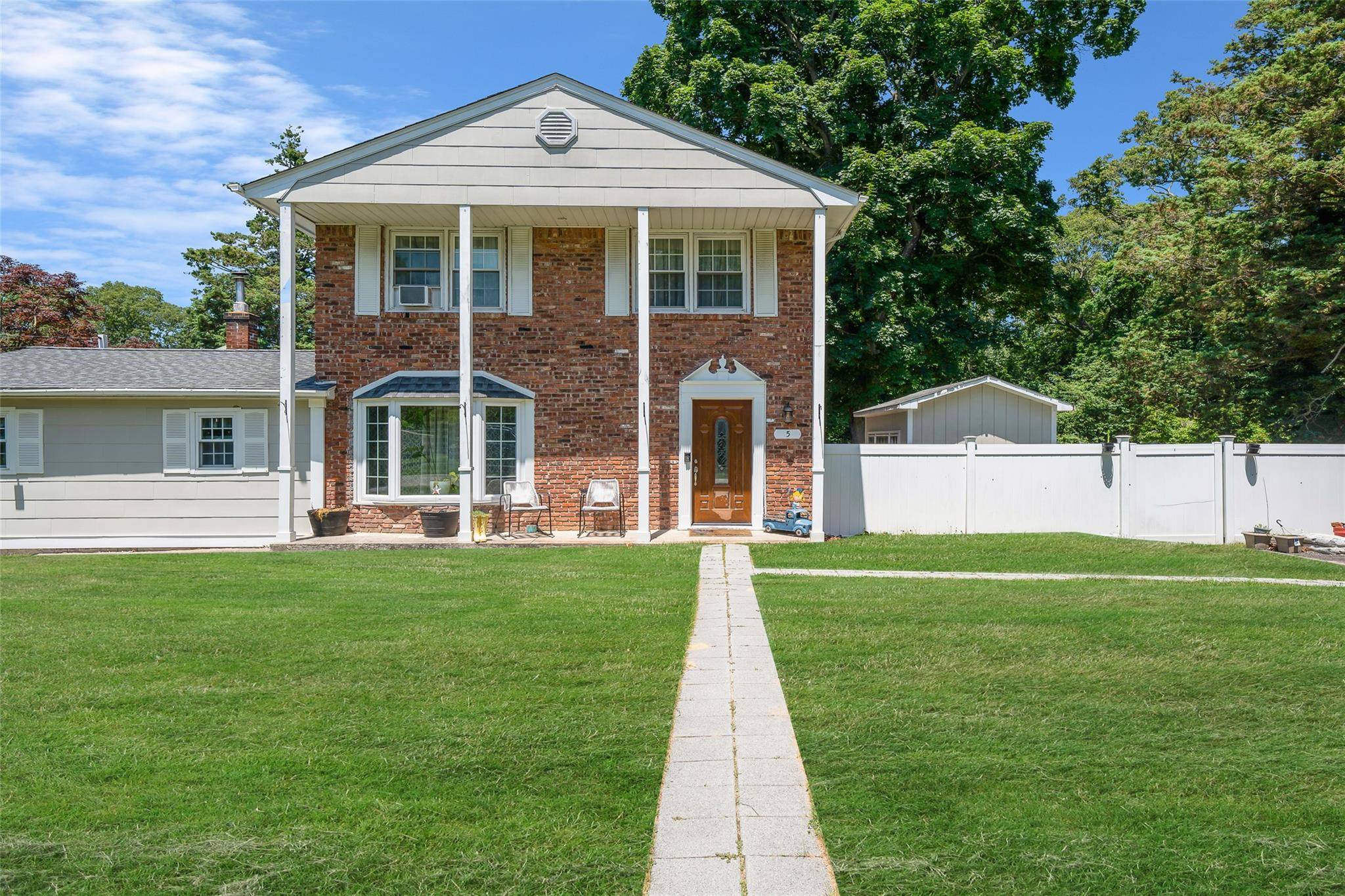 This beautifully updated home features a thoughtfully designed main level with a luxurious eat in kitchen, complete with white shaker cabinets, quartz countertops, stainless steel appliances, vaulted ceiling, and designer ...