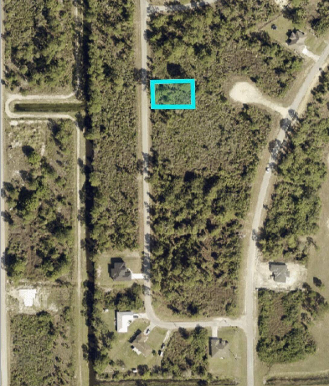 This. 25 acre lot in the east section of Lehigh Acres, is high and dry on a paved road and very convenient to Grant Bell Blvd.