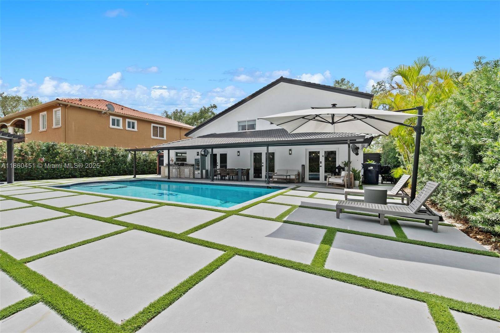 Discover this tastefully remodeled 5 bedroom residence in the prestigious Royal Oaks community of Miami Lakes, An extended driveway leads to a modern entrance, welcoming you into a home where ...