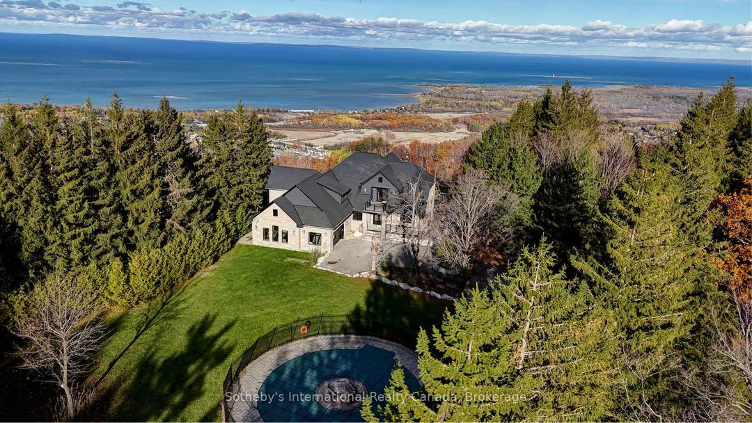 Spectacular estate perched atop Blue Mountain, offering breathtaking panoramic views of the ski hills, Georgian Bay, and the town of Collingwood.