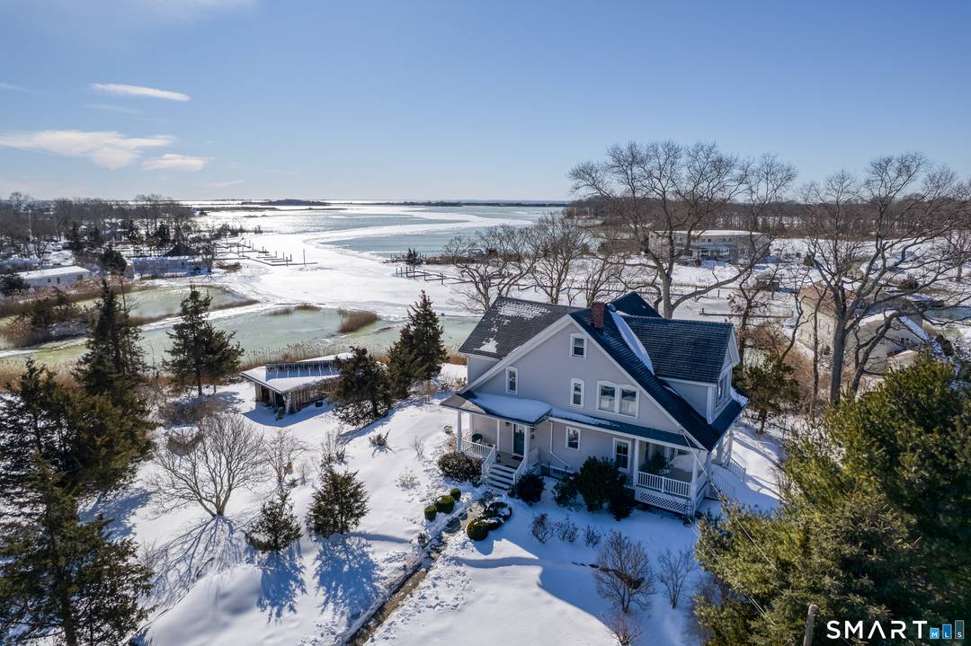 This beautiful B4 zoned waterfront property on the Madison Clinton line provides flexibility as a professional headquarters or a live work opportunity.