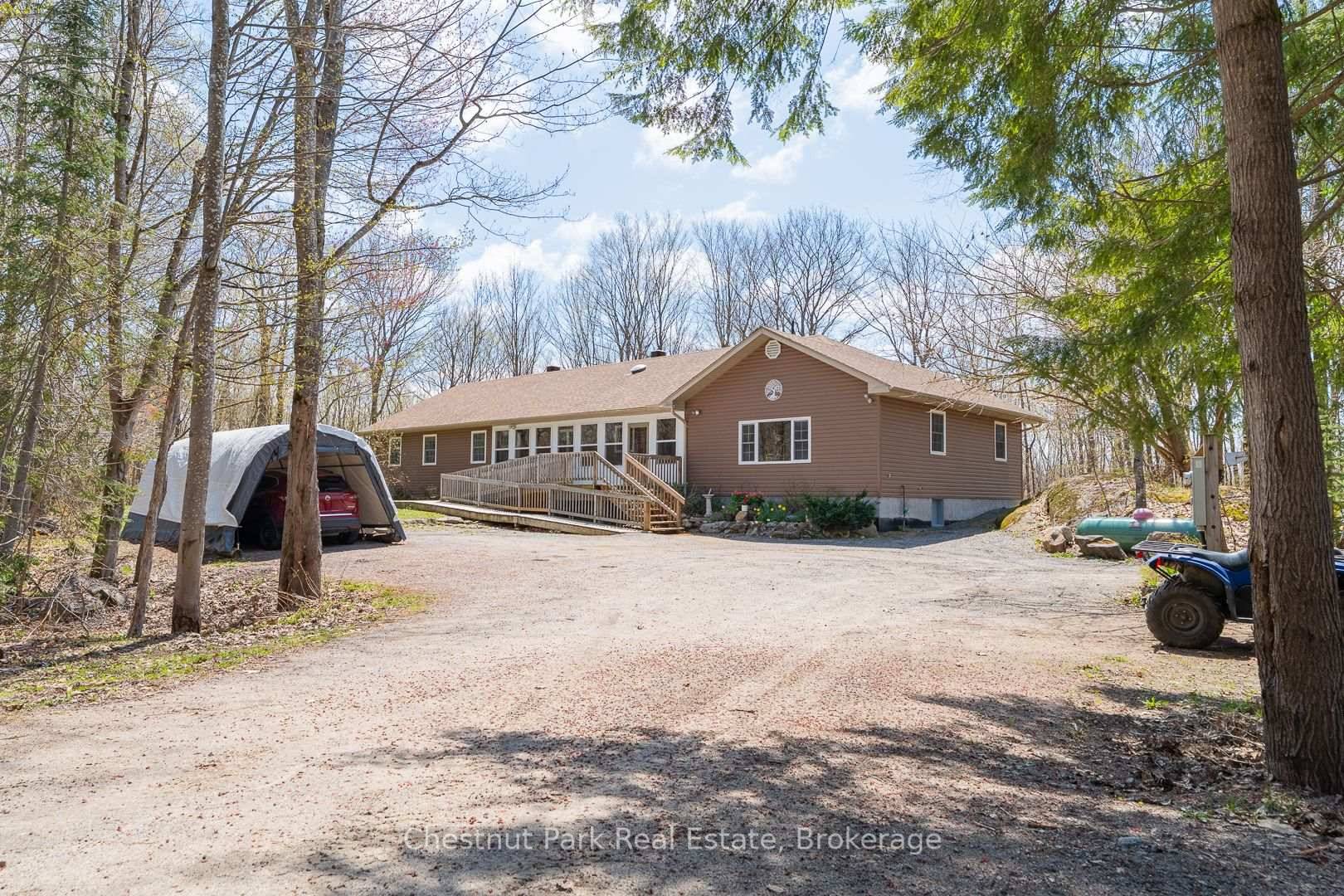 Tucked away on a breathtaking 32 Acre property just 10 minutes from Bracebridge, this thoughtfully designed home is a nature lover's paradise.