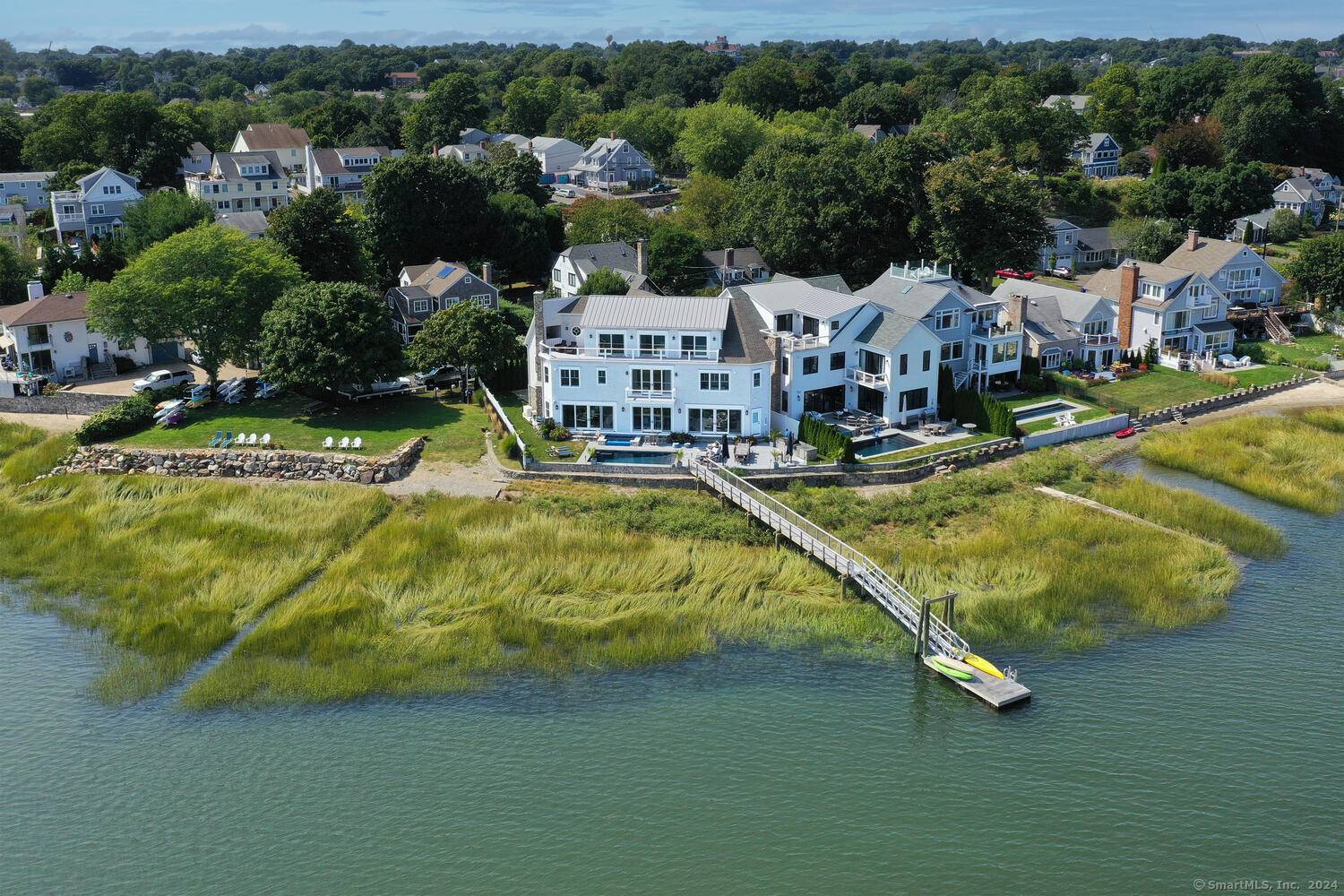 Welcome to 72 Shorefront Park a recently built waterfront FEMA compliant masterpiece by renowned CJT Builders, where luxury and lifestyle meet in perfect harmony.