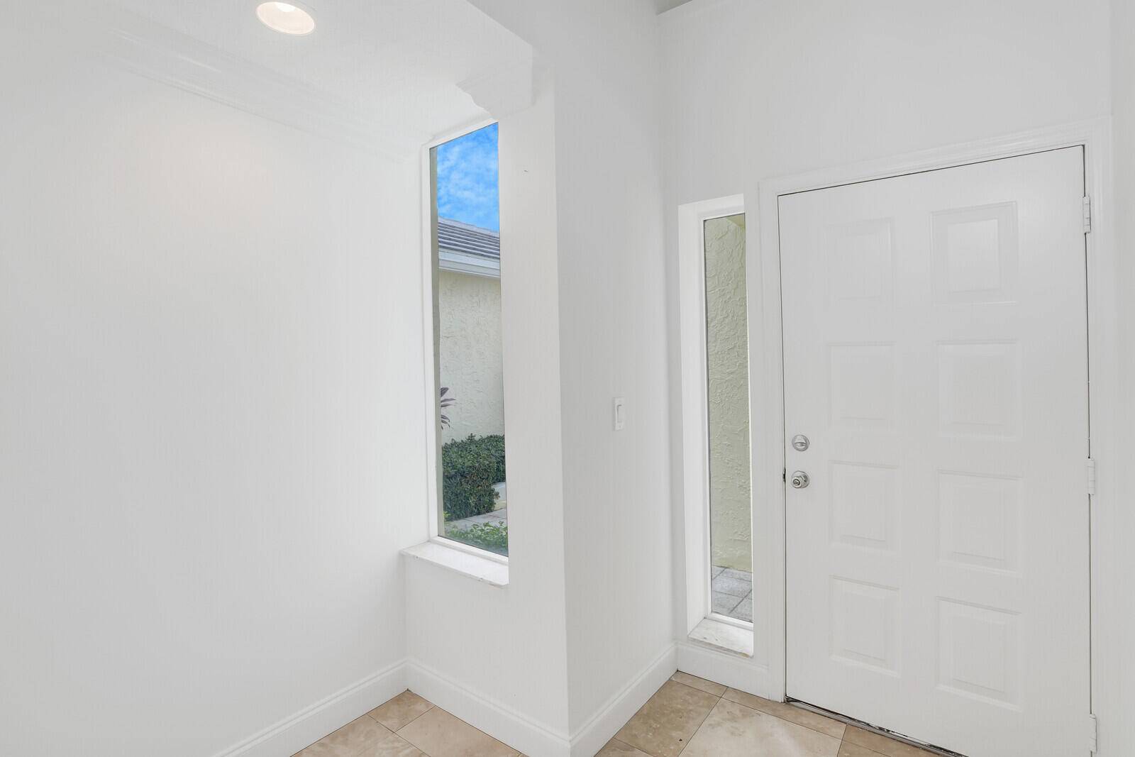 Experience the best of coastal living in this beautifully updated residence located in the coveted gated community of Sea Colony, just steps from Jupiter's pristine beaches.