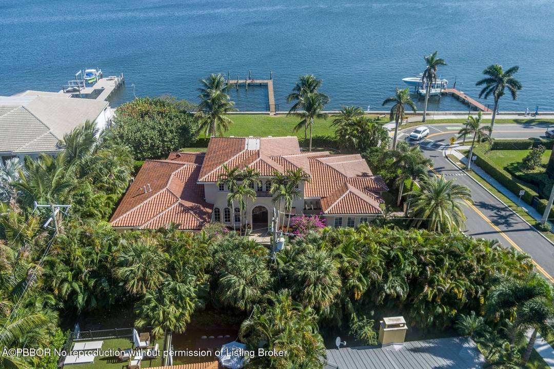 Enjoy beautiful views of the coveted Mar a lago Estate from this direct Intracoastal waterfront estate offering over 6000 total square feet of luxury living.