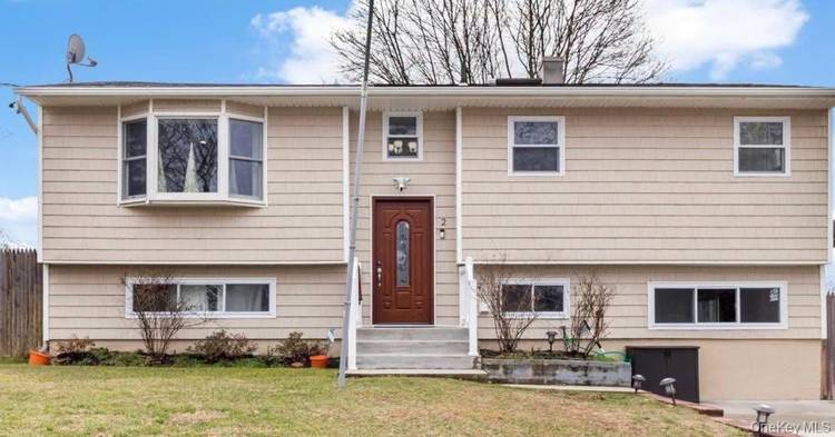 Spacious split level home located in Farmingville within the Sachem School District.
