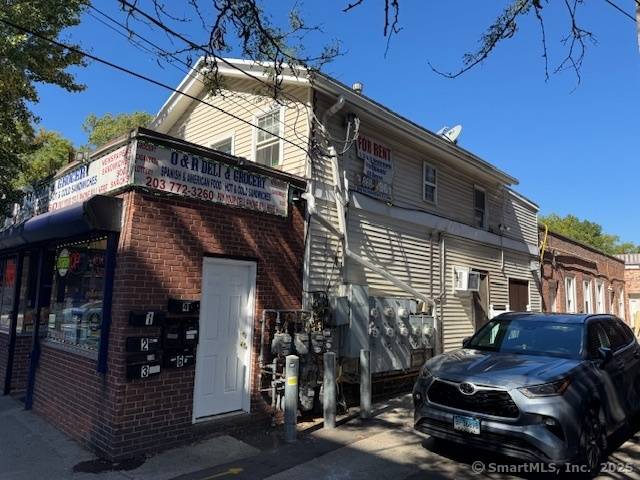Mixed use property in New Haven County featuring 7 residential units plus 1 commercial space on a 0.