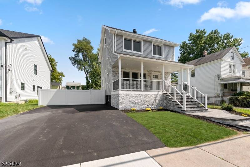 This colonial home was renovated in 2024 with an open floor concept living room, dining area and kitchen on the first floor.