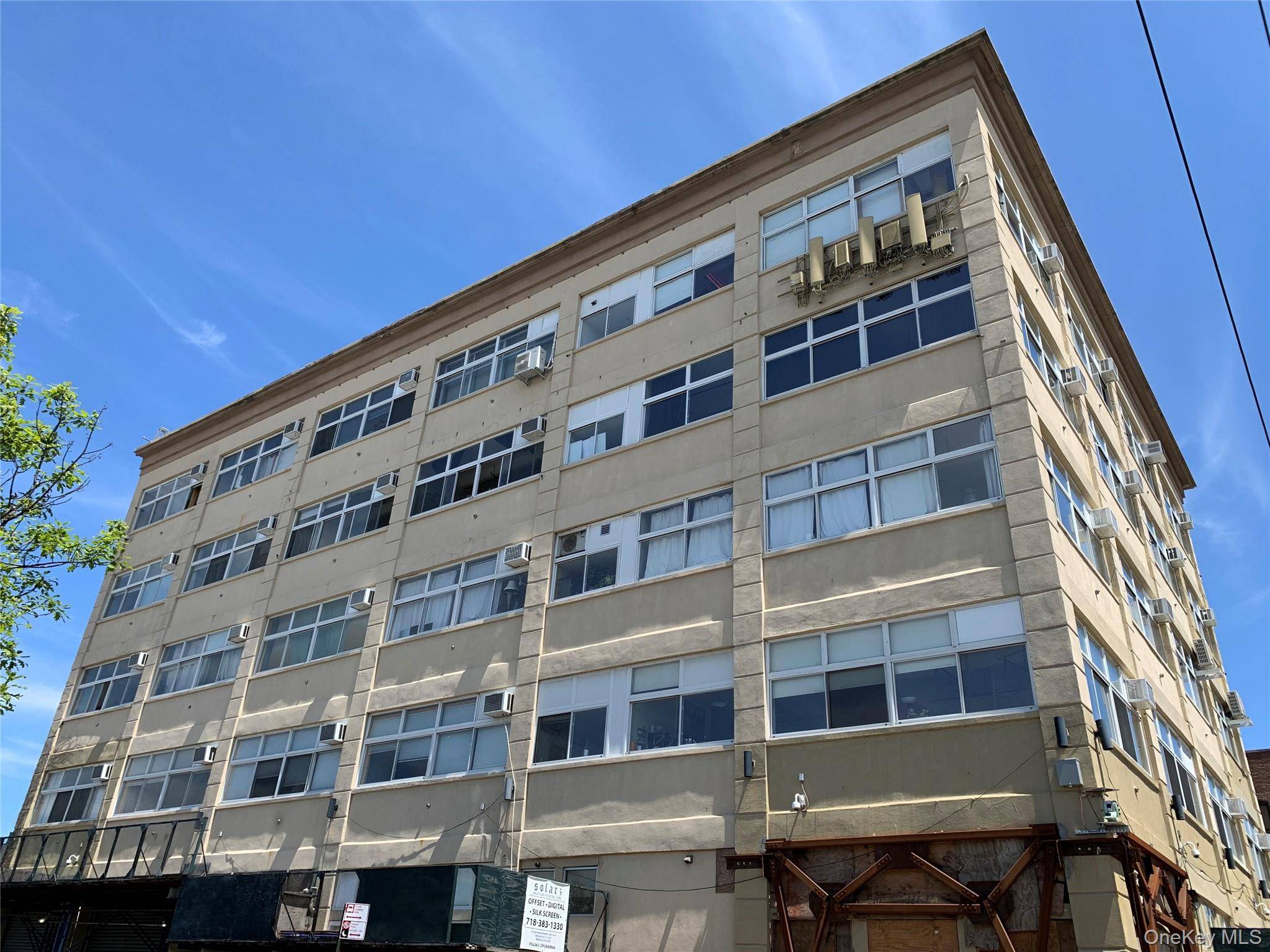 Prime Greenpoint Coomercial Condo with Sunlit Loft Space and Large Outdoor Private Patio for Sale.
