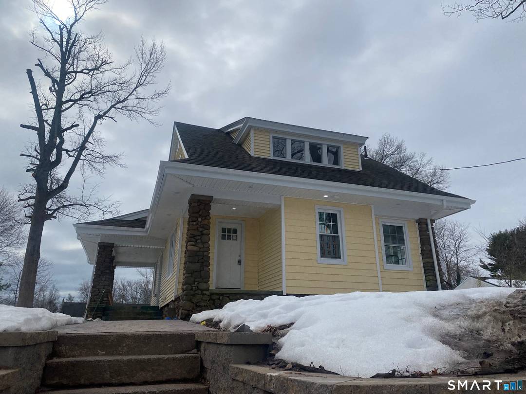 Charming Craftsman bungalow set proudly atop a hill in desirable Hamden !