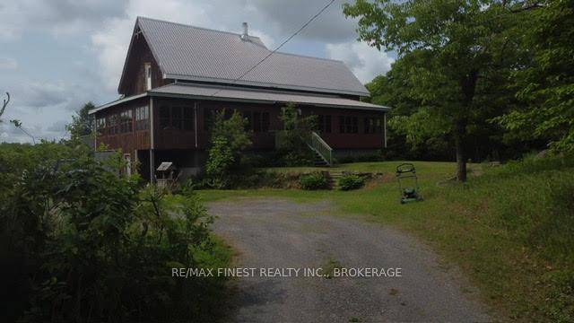 The house on the hill on 15 acres of scenic woods, trees, granite outcroppings garden areas and your own SEASONAL pond.