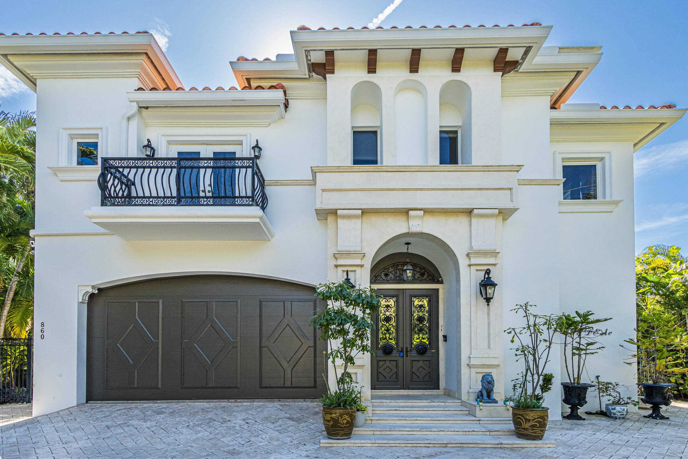 Wonderful Italian villa style home located one block from the Boca beach pavillion and intra coastal water way.