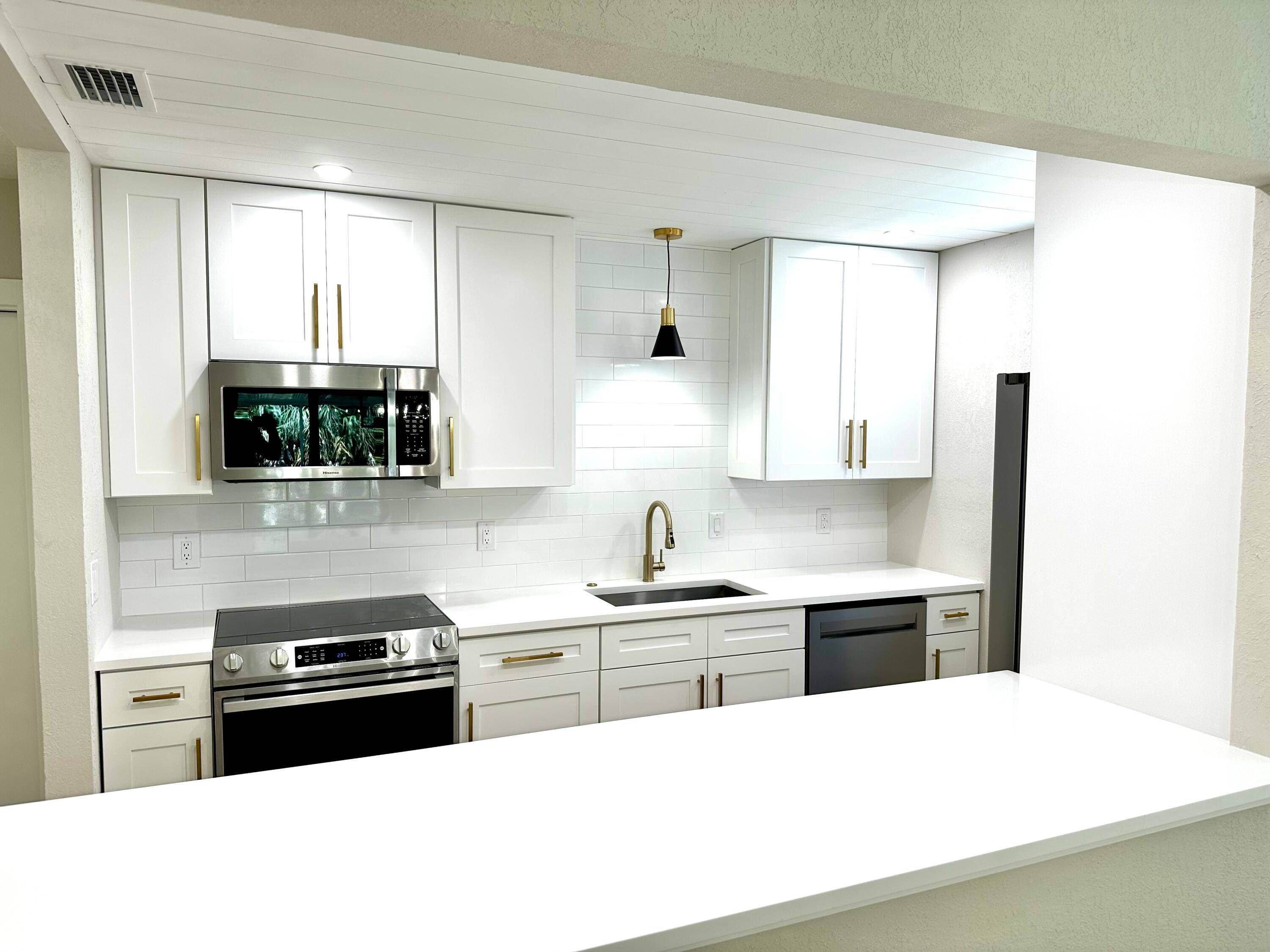 Move right in to this tastefully upgraded 4 bedroom, 2 bath home in Lantana Pines.