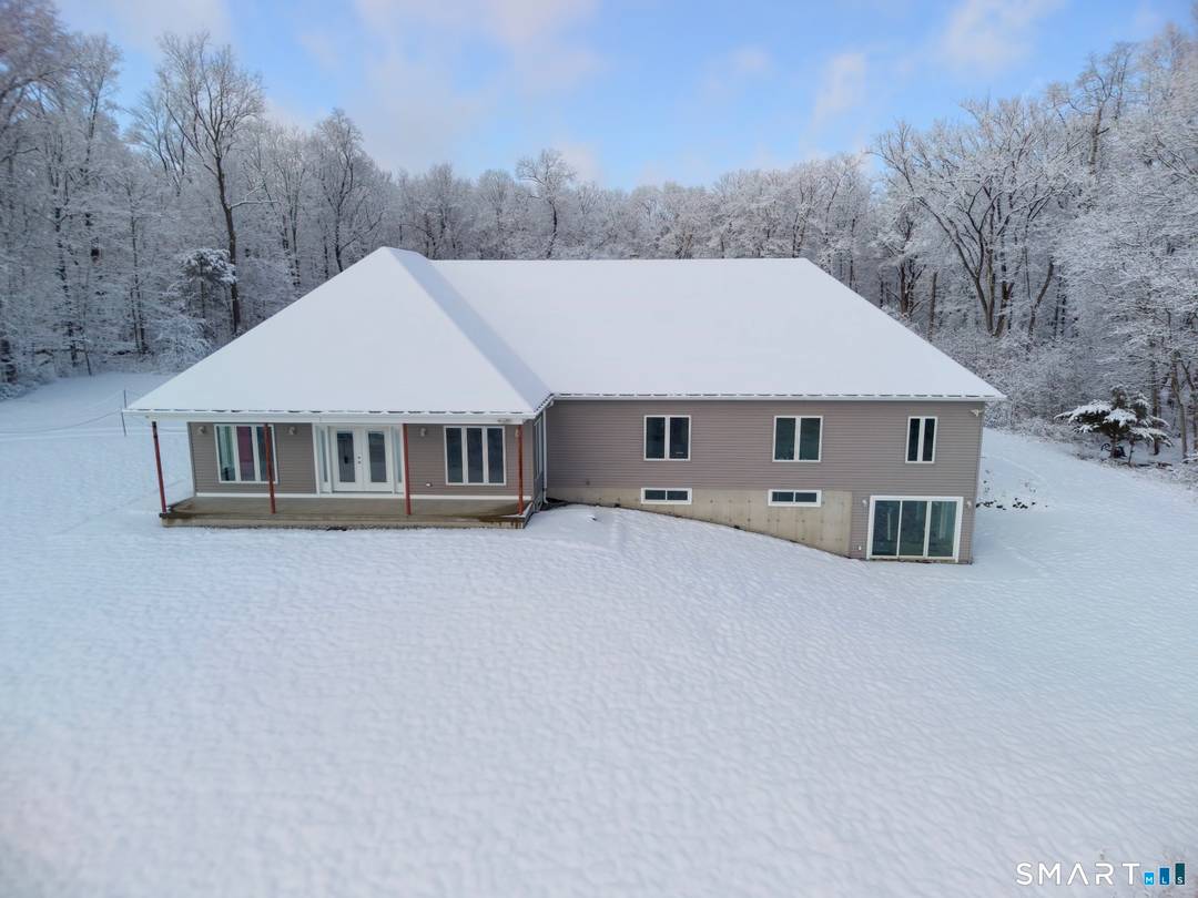 Tucked away on over 6 private acres in Durham, this extraordinary dream home is ready for your finishing touches.