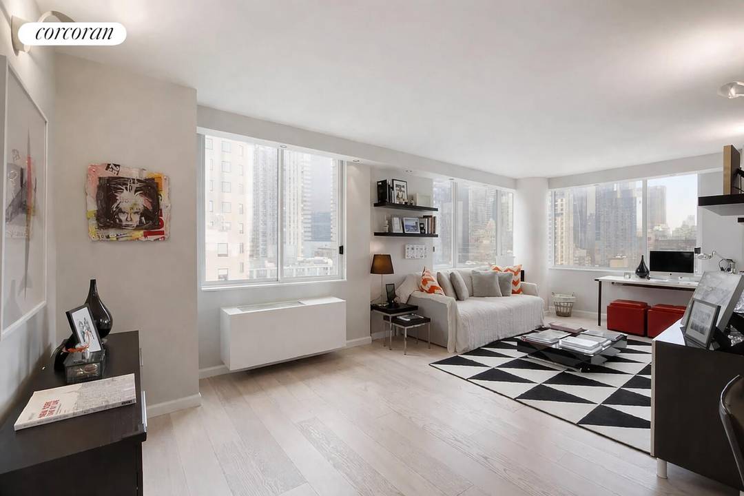 Welcome to Residence 20B at 350 West 50th Street, where luxury and convenience converge in the vibrant heart of Midtown West.