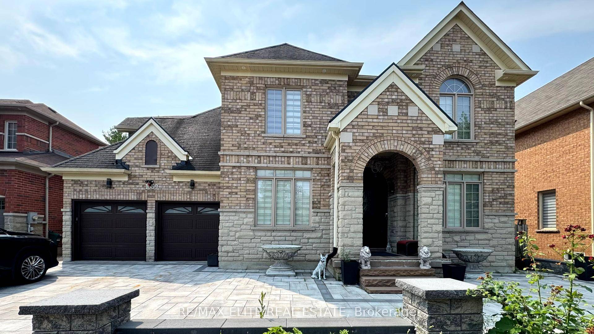 Exceptional 3 Car Tandem Garage Home with ravine backyard !
