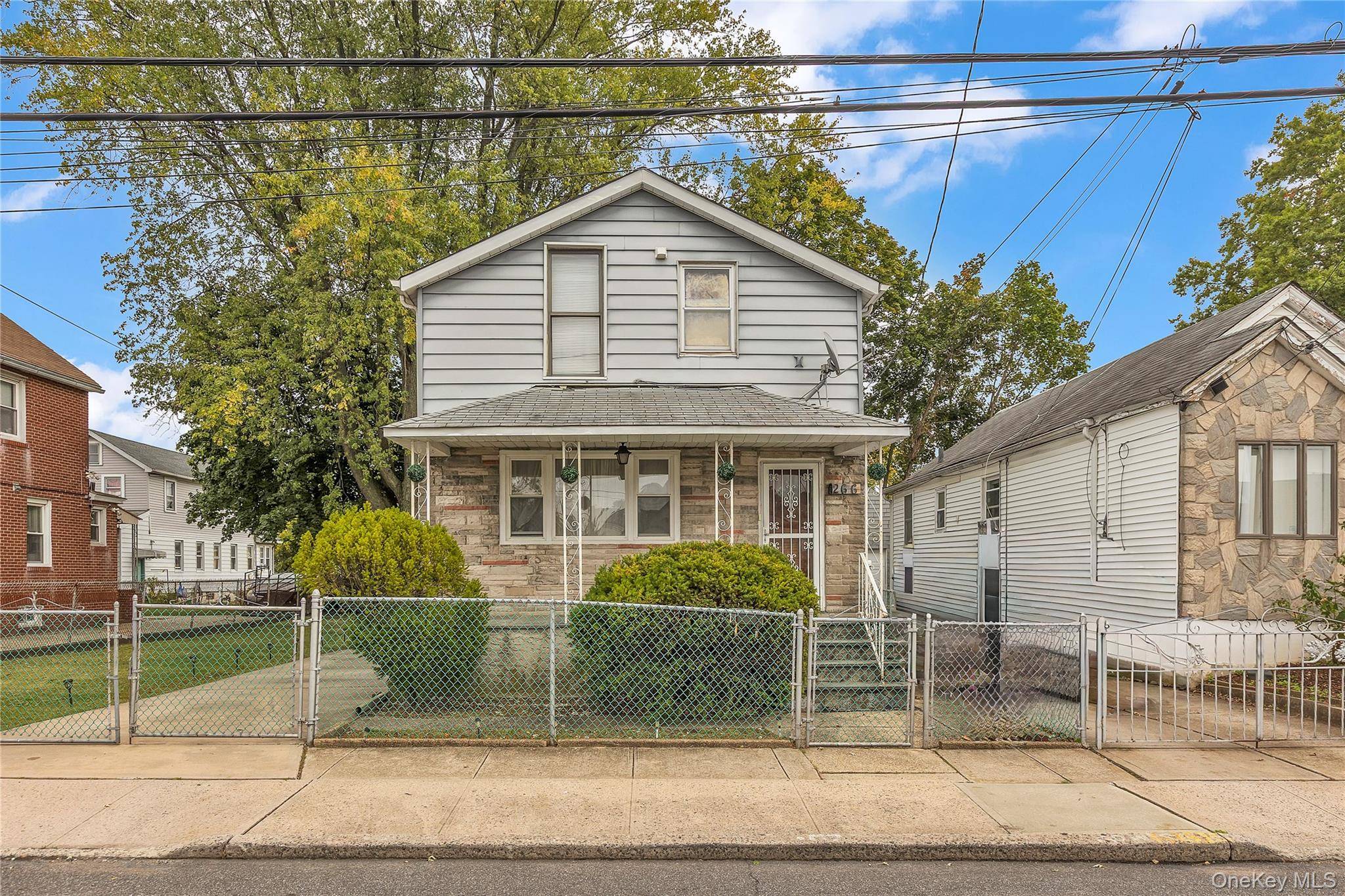 This 3 bed, 2 bath Colonial has great curb appeal but will require some TLC.
