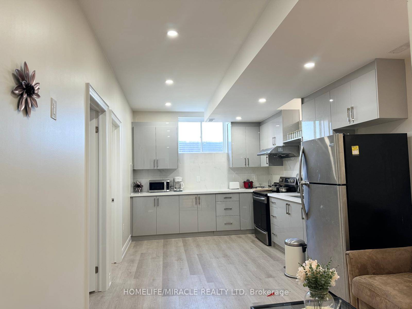 New legal 3 bedroom basement apartment in a corner townhouse with large, above ground windows for safety and natural light.