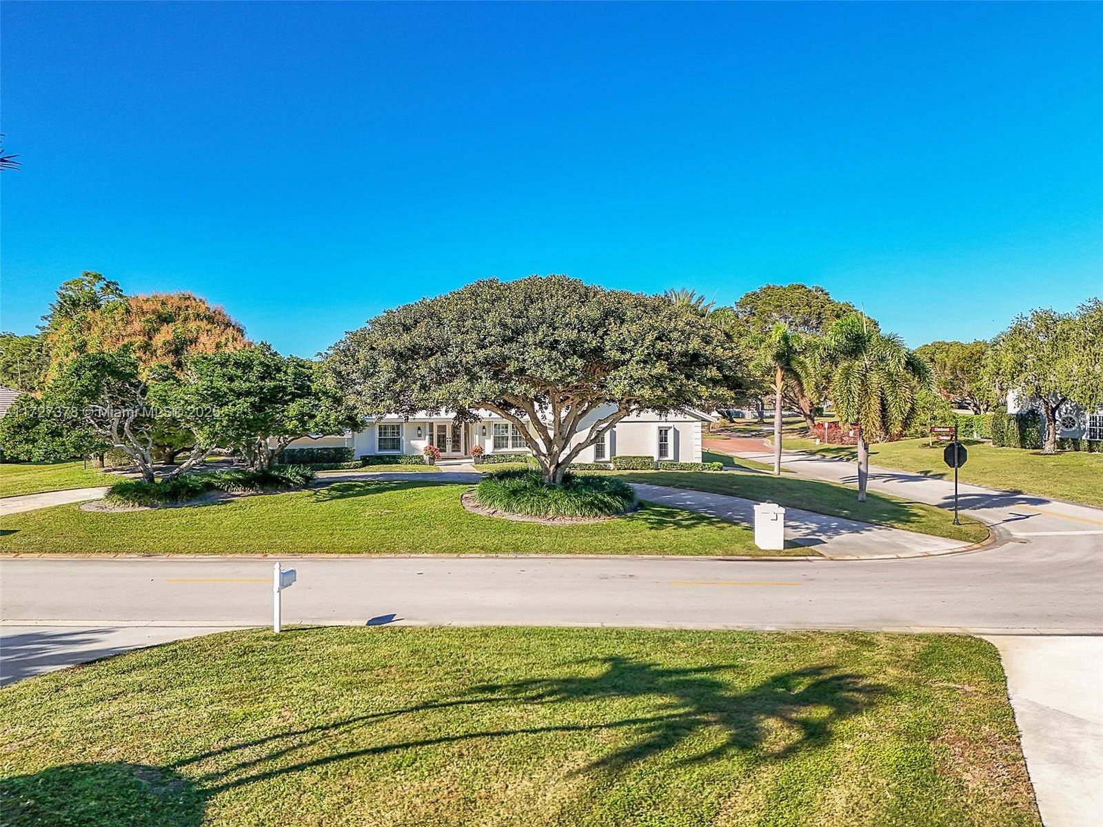 Gorgeous executive one level home on desirable oversized corner golf course lot with circular drive and 2 1 2 garage.