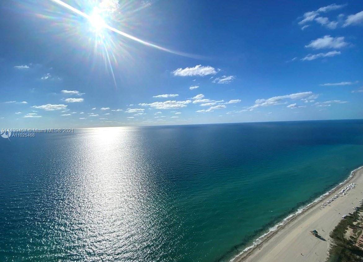HIGHLY DESIRABLE SOUTH EAST CORNER TURNKEY 4 BEDROOM RESIDENCE AT THE WORLD RENOWNED TURNBERRY OCEAN CLUB.