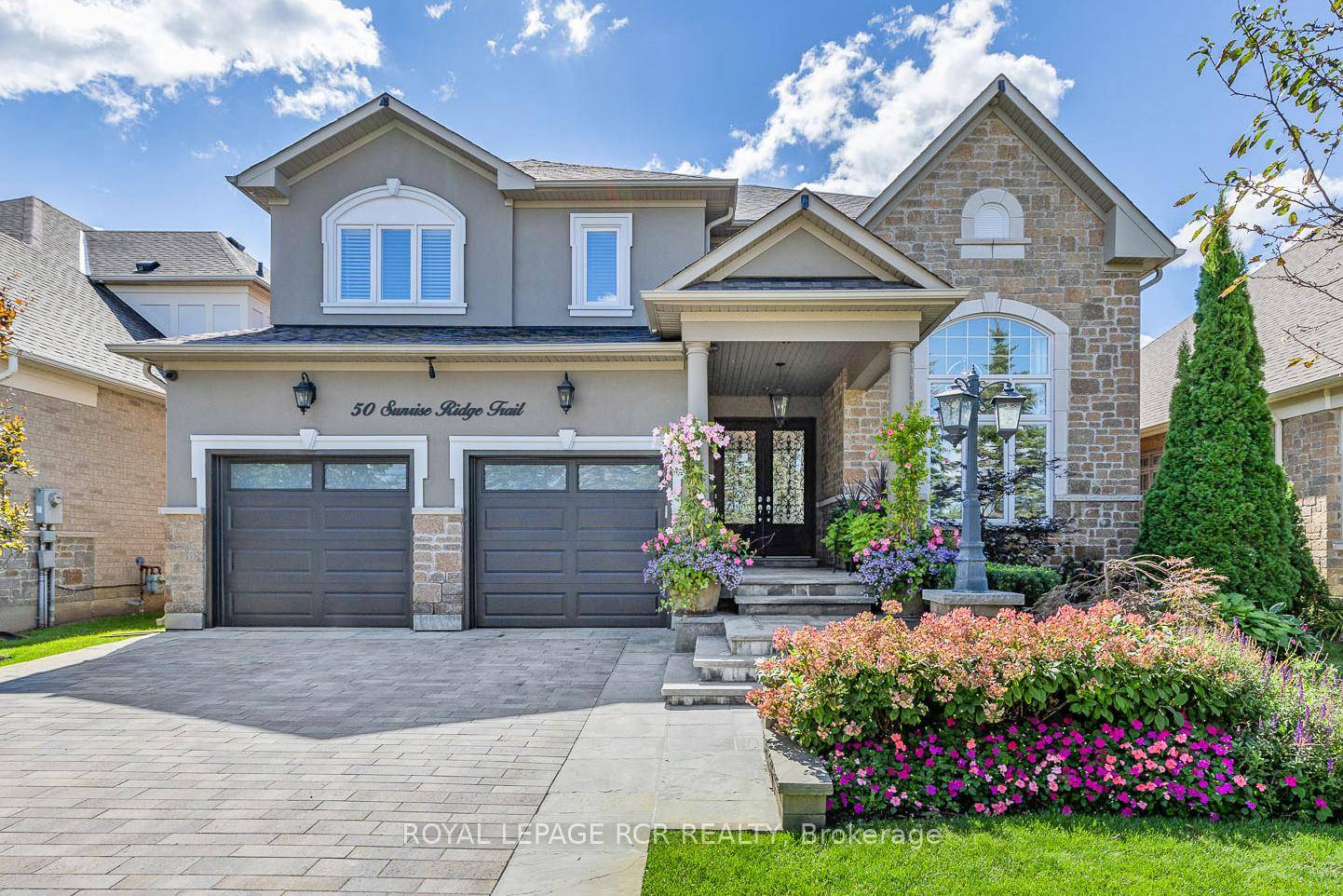 Stylish 2 Storey with walk out basement, In law suite, spectacular landscaping and breathtaking south views from an entertaining size 2 storey deck.